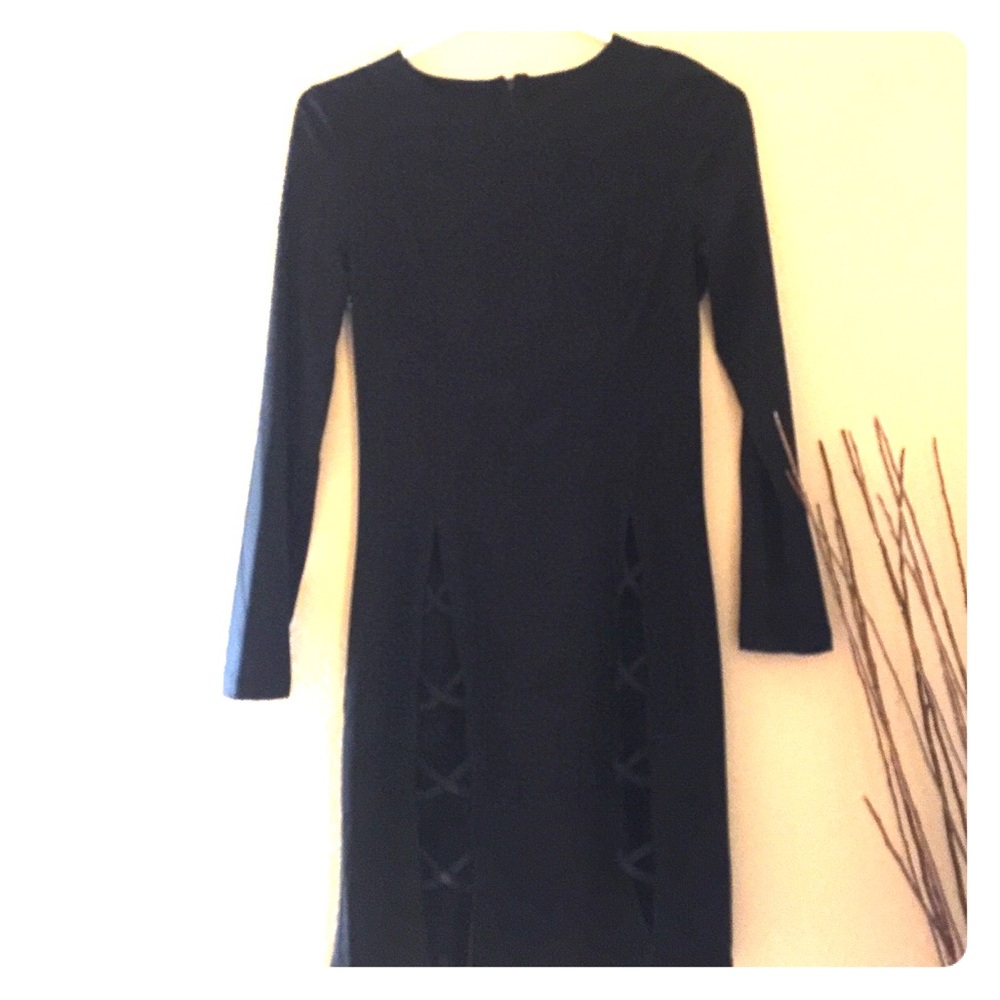 Plain black dress with cut outs on the bottom.